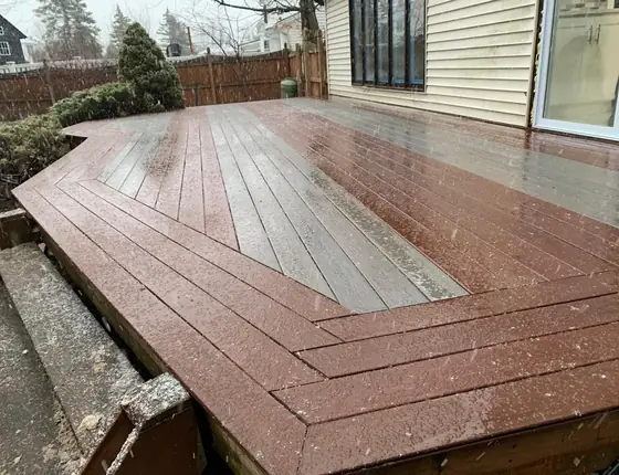 Composite deck with a decorative picture frame border pattern