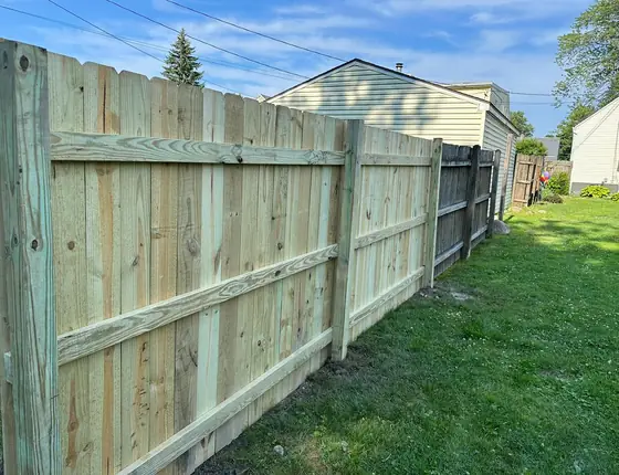 Fence rails and posts seen from the framing side