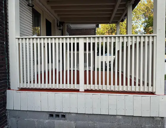 Front porch with a new cream balustrade and painted floor