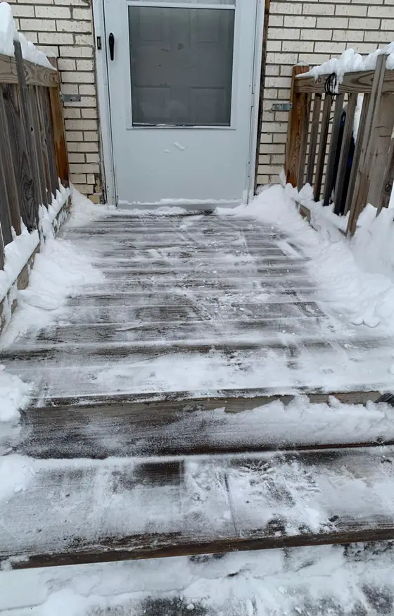 Back steps cleared and salted after snowfall